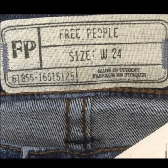 FREE PEOPLE REAGAN DESTROYED BUTTON FRONT JEANS