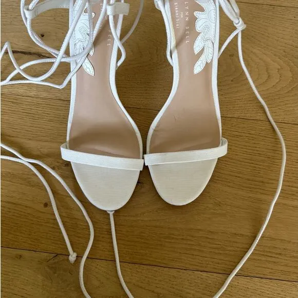 Gianni Bini x Caelynn Bell - Papillon Flower Ankle Wrap Strappy Sandals in White