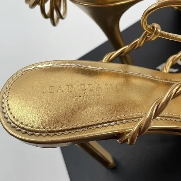 New in Box Marciano gold ankle wrap 4 in heel sandals size 6.5