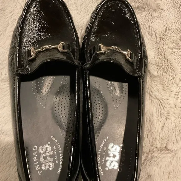 Sas Shiny Black Loafers with Silver Tone Metal Embellishment.