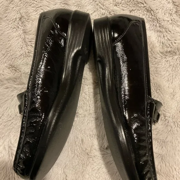 Sas Shiny Black Loafers with Silver Tone Metal Embellishment.