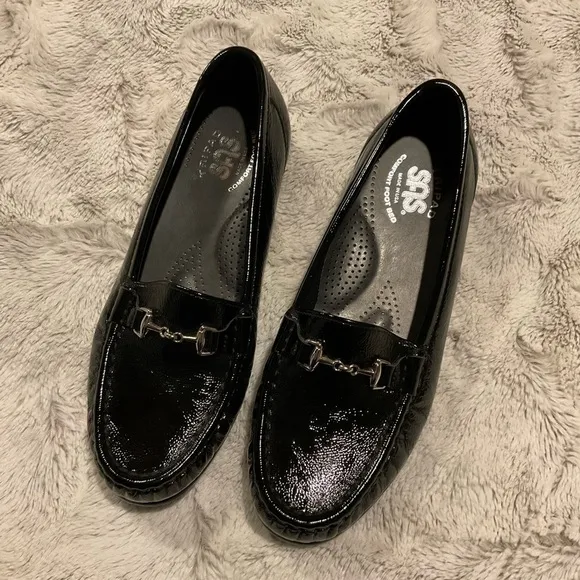 Sas Shiny Black Loafers with Silver Tone Metal Embellishment.