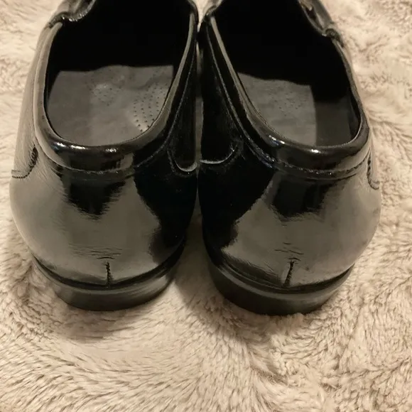 Sas Shiny Black Loafers with Silver Tone Metal Embellishment.