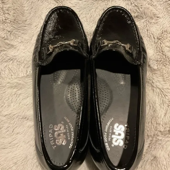 Sas Shiny Black Loafers with Silver Tone Metal Embellishment.