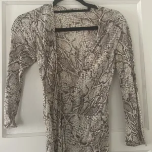Snake print reformation wrap dress