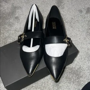 Versace Couture, buckle flats. New with tags, never used, fit tru to size